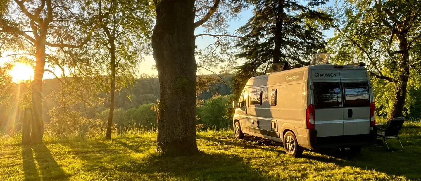 Motorhome parked at dusk on a service area, overnight parking rules 2026