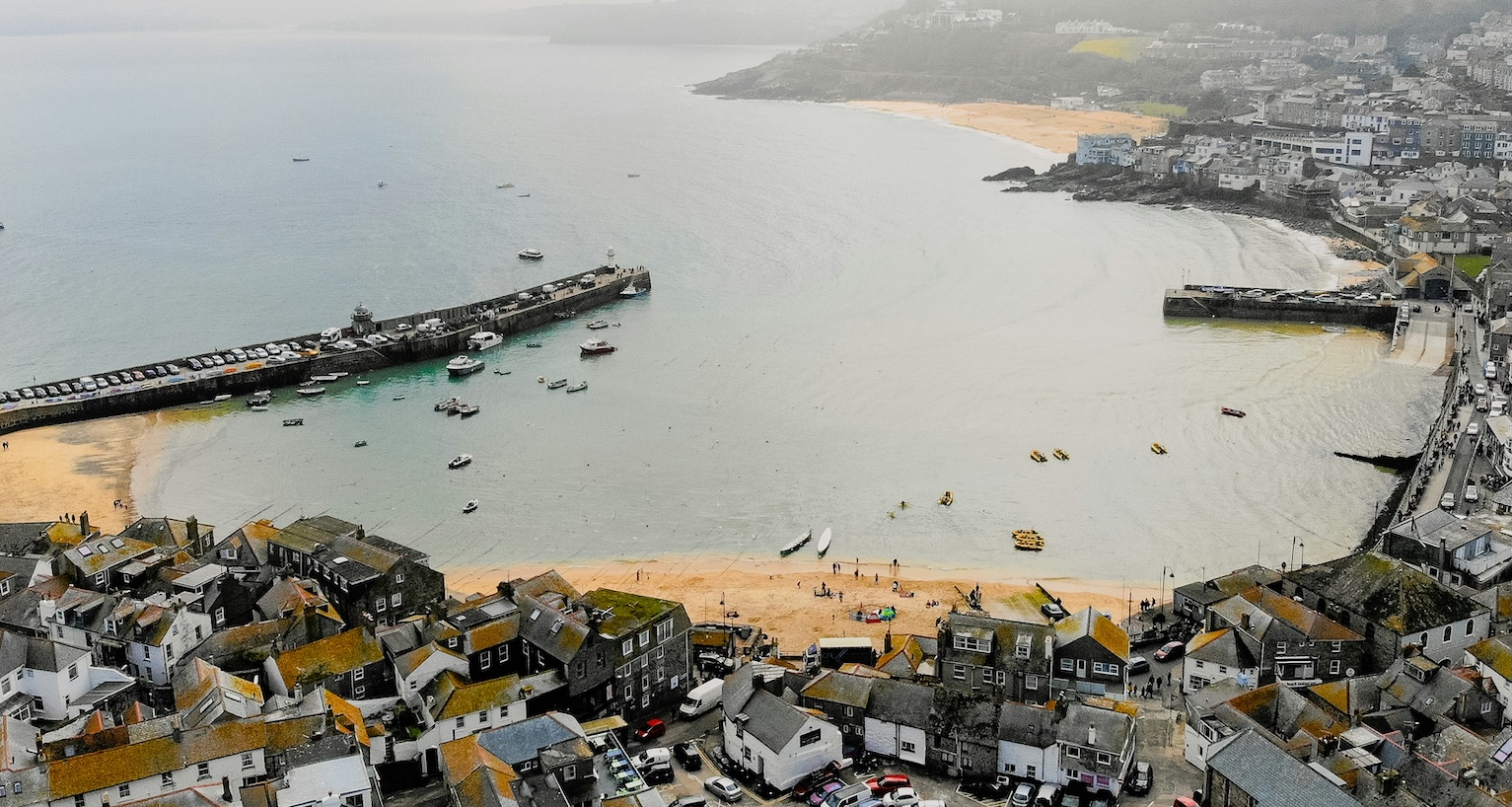 St Ives Bay, Cornwall, United Kingdom: a beautiful crescent-shaped bay with golden sandy beaches, turquoise waters and sweeping views of the Cornish coastline.