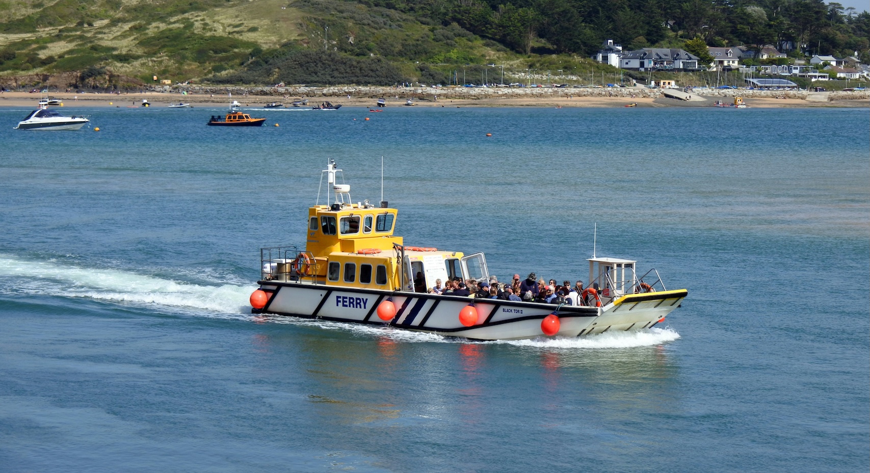 Padstow Ferry, Cornwall, United Kingdom: a scenic ferry crossing on the Camel Estuary, with beautiful views of the harbour, sailboats and the rugged Cornish coastline.