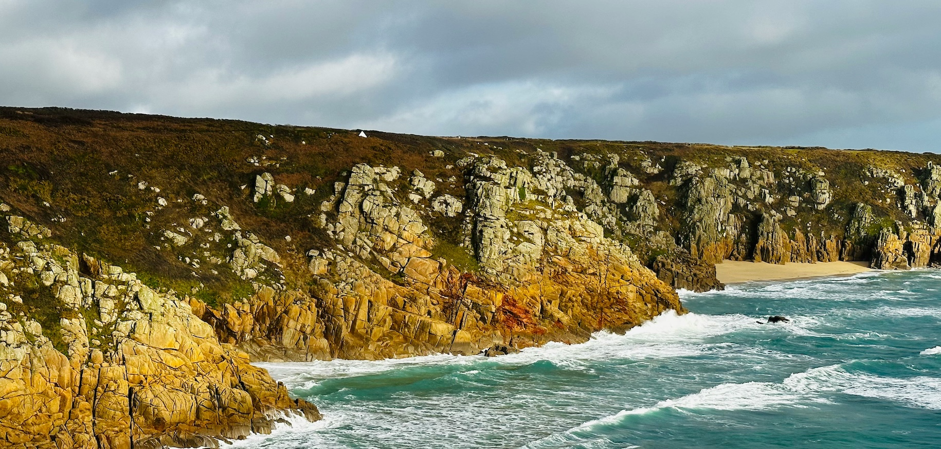 Porthcurno Beach, Cornwall, United Kingdom: a stunning sandy beach with turquoise waters, dramatic cliffs and breathtaking coastal scenery.